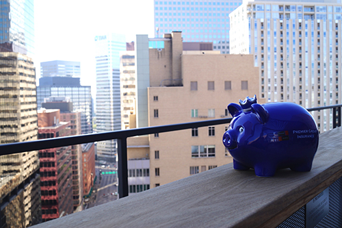 a piggy bank sitting on top of a building